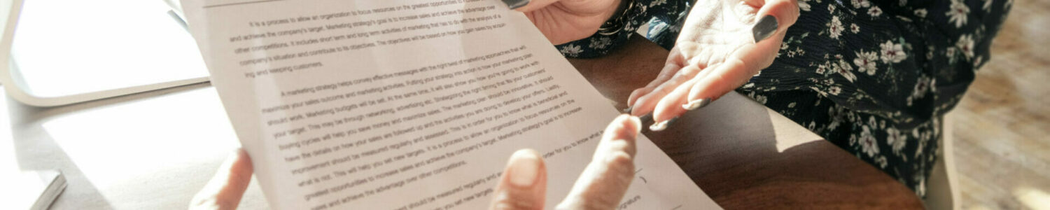 Woman explaining about a contract details Woman explaining about a contract details